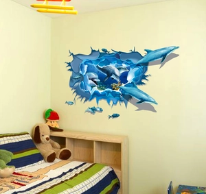 Detail of 3D dolphin wall sticker showing blue ocean reef effect through broken wall effect