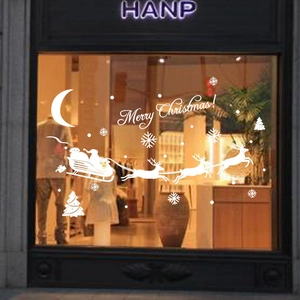 White Christmas window decals featuring Santa, reindeer sleigh and Merry Christmas text