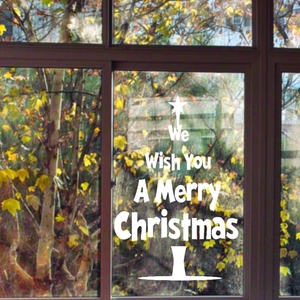 Close-up of white star Christmas window decal with Merry Christmas holiday lettering