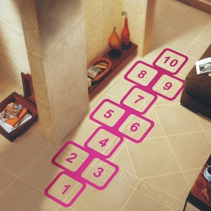 Colorful hopscotch floor decals for kids bedroom featuring numbered 1 to 10 pink squares