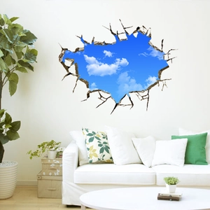 Creative 3D wall sticker featuring blue sky and white clouds breaking through a white wall