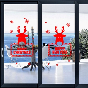 Red Christmas reindeer window decals with snowflake motifs for festive glass decoration