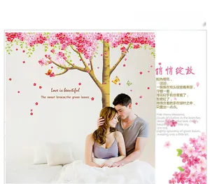 Detail of pink cherry blossom wall stickers with butterflies and romantic verse