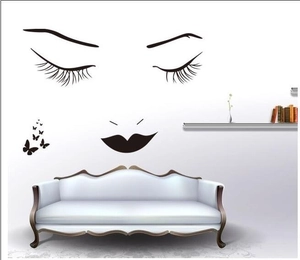 Minimalist black eyelashes and butterfly wall decal for modern living room decor