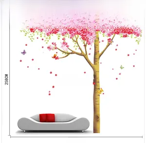 Detail view of pink cherry blossom wall decal with butterfly accents for living room decor