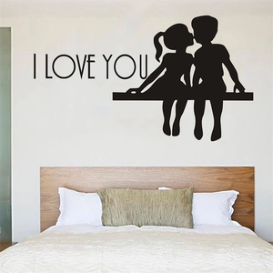 Romantic I LOVE YOU wall sticker featuring a silhouette couple kissing for bedroom decor