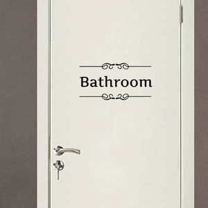 Minimalist black Bathroom wall sticker with elegant scroll patterns on a white door