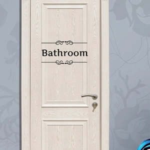 Minimalist black vinyl bathroom door sticker with elegant scroll patterns on wood door
