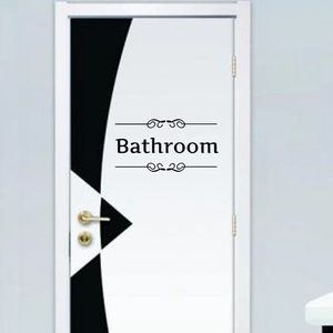 Minimalist black vinyl Bathroom wall sticker with elegant scroll patterns on a white door