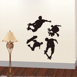 Dynamic black silhouette wall decals of skateboarders for modern interior bedroom decor