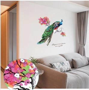 Detail of creative peacock and plum blossom wall sticker on a modern living room wall