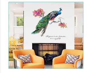 Detailed view of peacock wall decal on a floral branch with inspirational English quote
