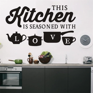 Black vinyl kitchen wall sticker with 'Seasoned with Love' text and utensil silhouettes