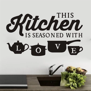 Self-adhesive black vinyl kitchen wall decal featuring Kitchen seasoned with Love quote