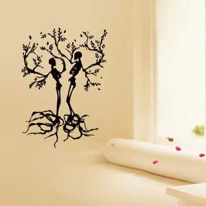 Detailed view of Gothic Tree of Life wall decal with skulls on a minimalist bedroom wall
