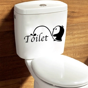 Funny black penguin toilet sticker with creative lettering on white ceramic background