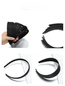Close-up of black matte plastic headbands in various widths for DIY hair accessories