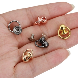 Copper nipple rivets with rings in four metallic finishes shown on a palm for DIY crafts