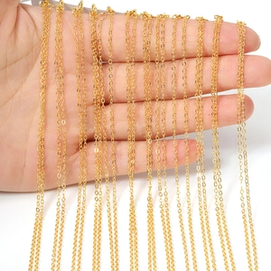 Detail of multiple shiny gold-plated link chains for DIY jewelry making with lobster clasps