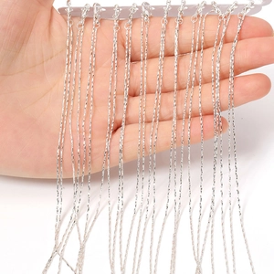 Detail of thin silver metal necklace chains with lobster clasps for DIY jewelry making