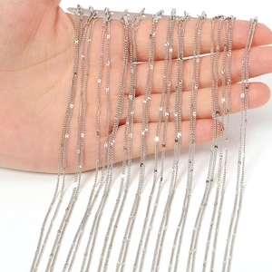 Close-up of bright silver metal chains with lobster clasps for DIY jewelry making