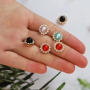 Golden sunflower rhinestones and pearls DIY jewelry accessory shown held in hand