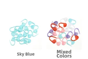 Close-up of sky blue and mixed color plastic knitting stitch markers with locking design