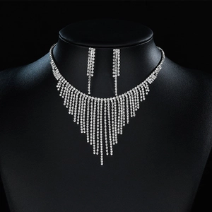 Elegant silver fringe necklace and earrings set with sparkling rhinestones for bridal wear