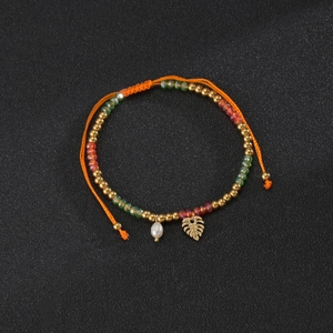 Bohemian adjustable orange cord bracelet with glass beads, pearl and monstera leaf pendant