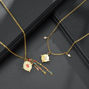 Golden stainless steel necklace set featuring star pendants with colorful beads and pearls