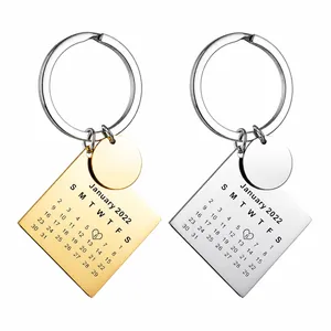 Detailed engraving of a personalized calendar keychain in gold and silver finish