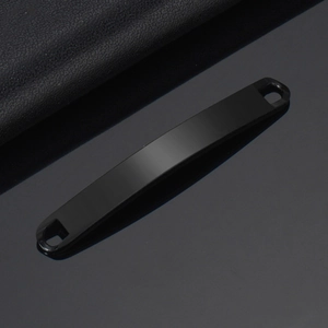 Close-up of black matte stainless steel curved plate with dual holes for bracelets