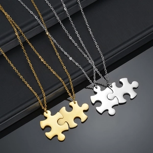 Matching gold and silver stainless steel puzzle piece pendant necklaces for couples