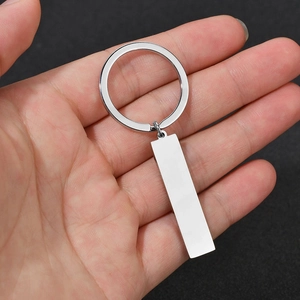 Polished stainless steel keychain with a rectangular blank tag for custom engraving