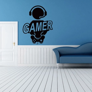 Dettaglio adesivo murale gamer nero con sagoma cuffie e controller su parete blu