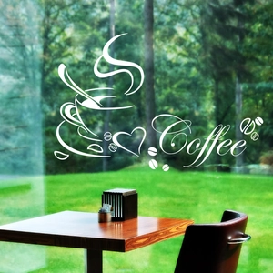 Detail showing white vinyl coffee cup wall decal with lettering on glass partition