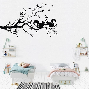 Black silhouette wall sticker featuring squirrels on branches for kids' bedroom
