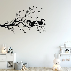 Detail of black bird and squirrel branch wall decal in a white nursery room setting