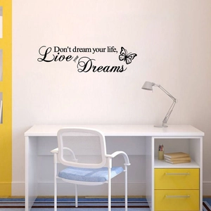 Detail of Live Your Dreams wall decal with butterfly in a cozy home office setting
