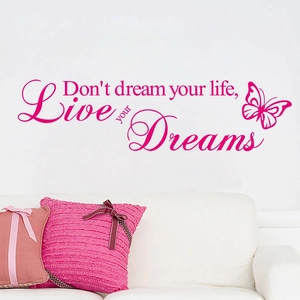 Close-up of rose red Live Your Dreams wall sticker with butterfly on a white wall