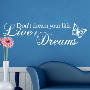 Inspirational white wall decal Live your dreams with butterfly on dark blue wall background