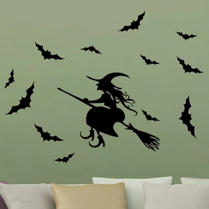 Detail of Halloween witch on broom and bats silhouettes on green interior wall stickers
