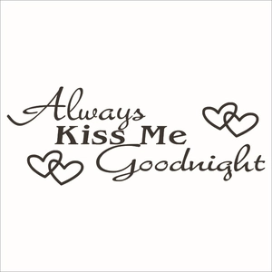 Detail of Always Kiss Me Goodnight wall decal with four minimalist heart accents