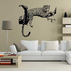Detailed view of black leopard silhouette wall sticker on tree branch for home decor