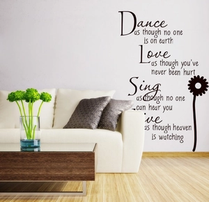 Detail of black vinyl wall decal with inspirational quotes and daisy flower silhouette
