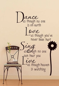 Detail of inspirational black PVC wall sticker with dance and love quotes and sunflower art