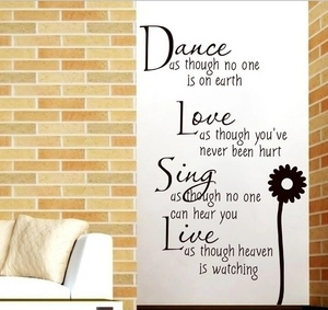 Inspirational black wall decal with motivational quotes and sunflower in minimalist room