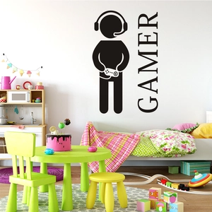 Vibrant kids room wall detail featuring black gamer silhouette decal and gamer lettering