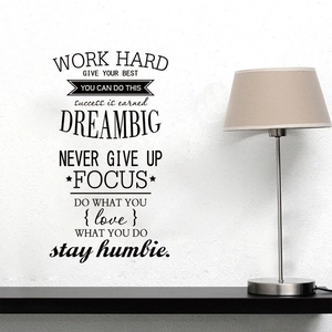 Macro view of inspirational black vinyl wall stickers featuring WORK HARD and DREAM BIG quotes