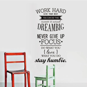 Inspirational black vinyl wall stickers with Dream Big quotes on a white living room wall